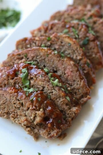 Meatloaf sliced on platter.