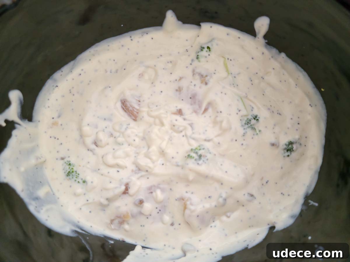 Slow-Cooker Chicken Poppy Seed Casserole Recipe 6 chicken, broccoli, and white poppy seed sauce in a crock pot.