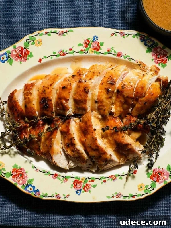 Mandarin Orange Cranberry Sauce Recipe — Ready in 20 Minutes 9 A platter of sliced chicken breast with chicken gravy.
