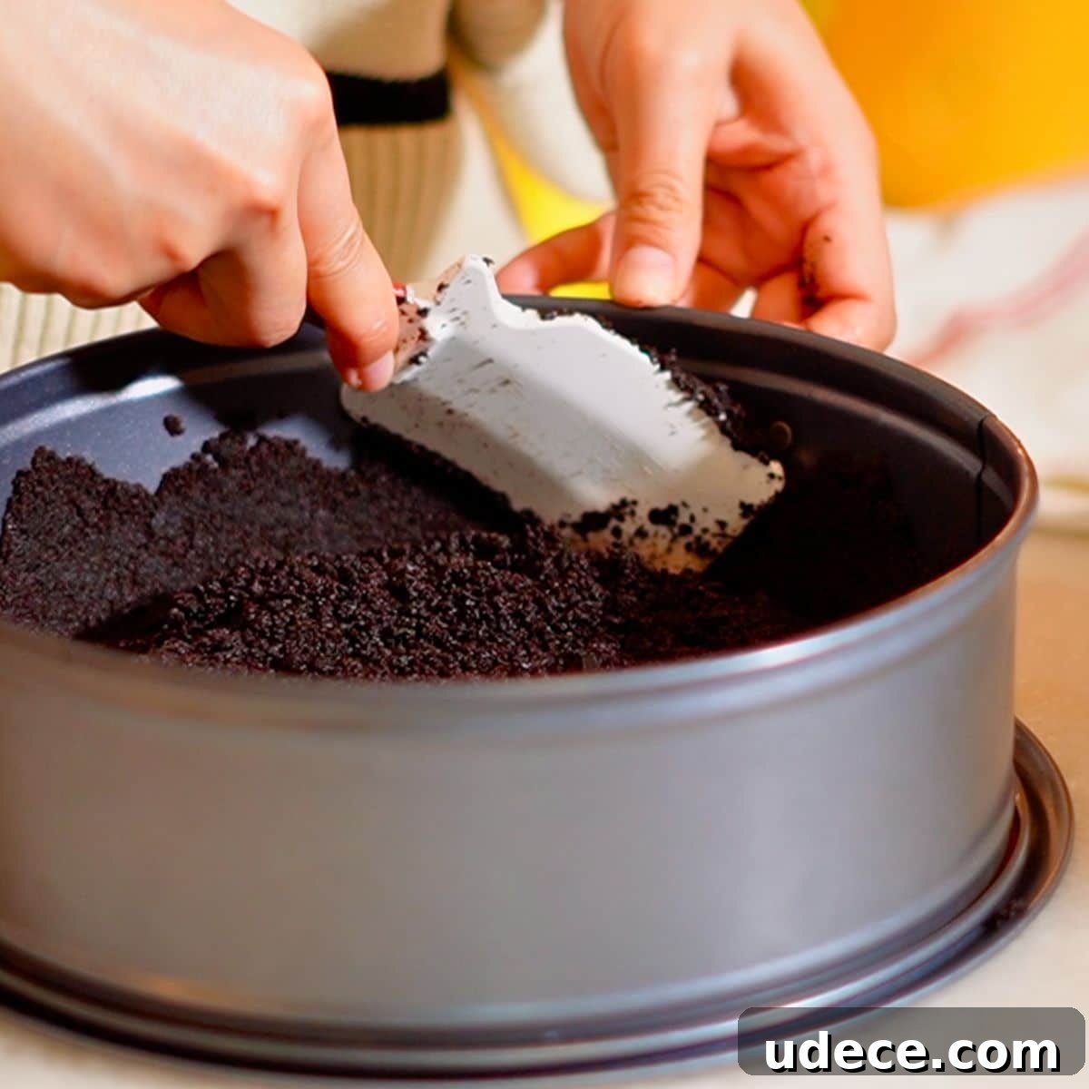 Decadent French Silk Pie Recipe: Smooth Chocolate Silk Pie 11 Pressing the Oreo crust on the pan.