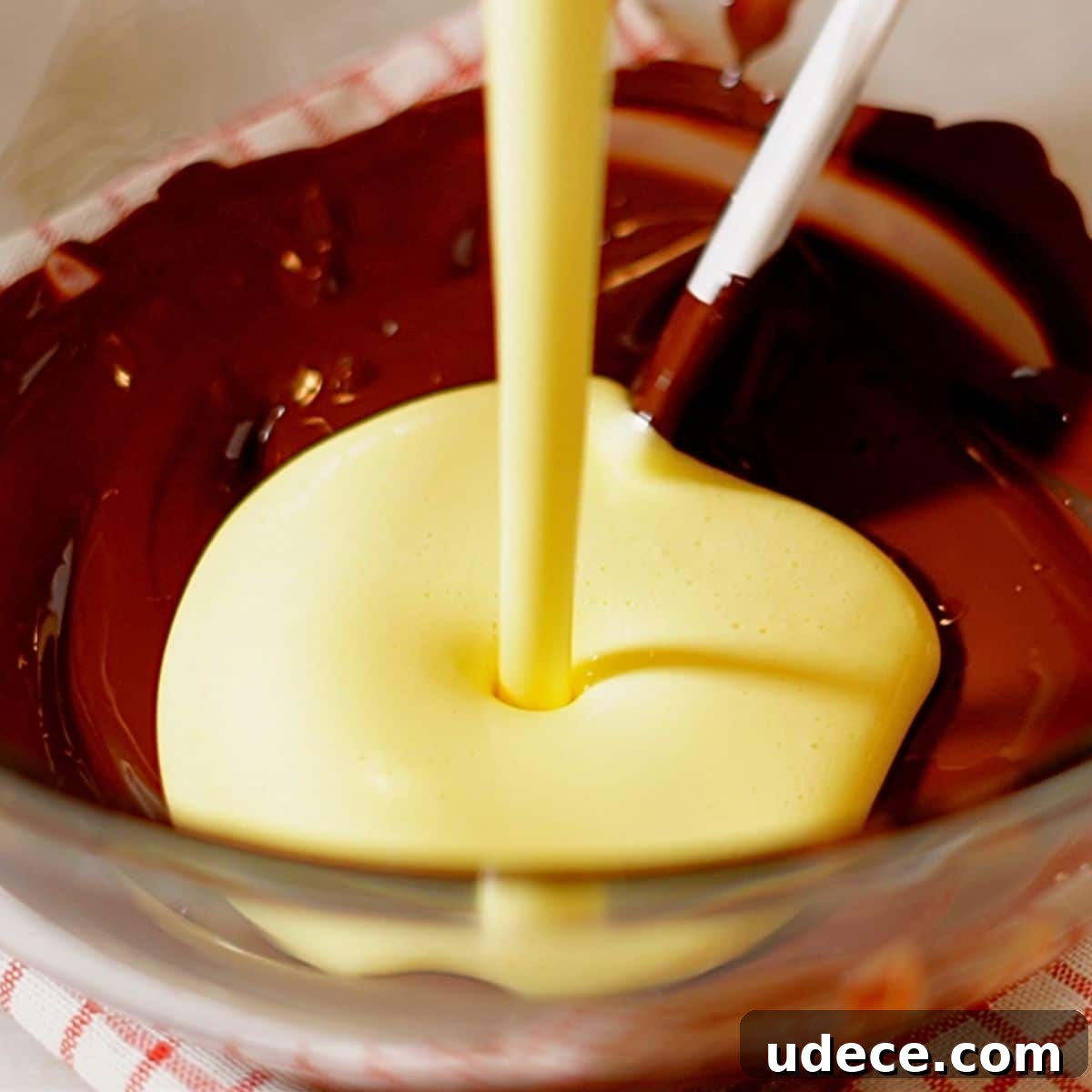 Decadent French Silk Pie Recipe: Smooth Chocolate Silk Pie 19 Adding the pate a bombe (the whipped yolk foams) to the melted chocolate.