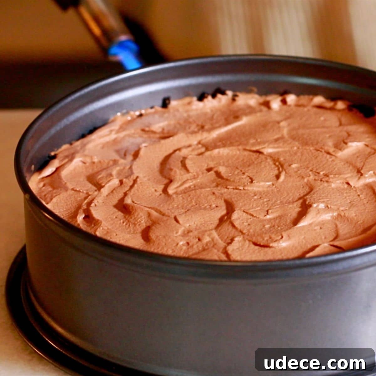 Decadent French Silk Pie Recipe: Smooth Chocolate Silk Pie 23 Heating the sides of the springform pan with a blow torch.