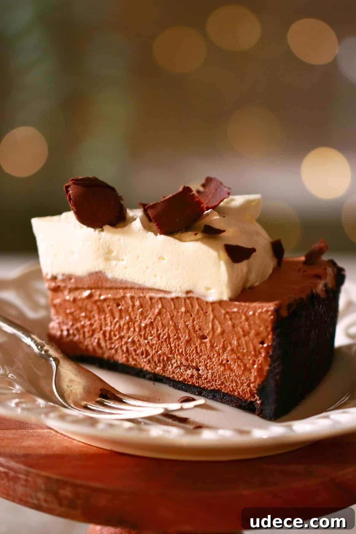 Decadent French Silk Pie Recipe: Smooth Chocolate Silk Pie 26 A slice of homemade French silk pie with Oreo crust and whipped cream and chocolate curls toppings