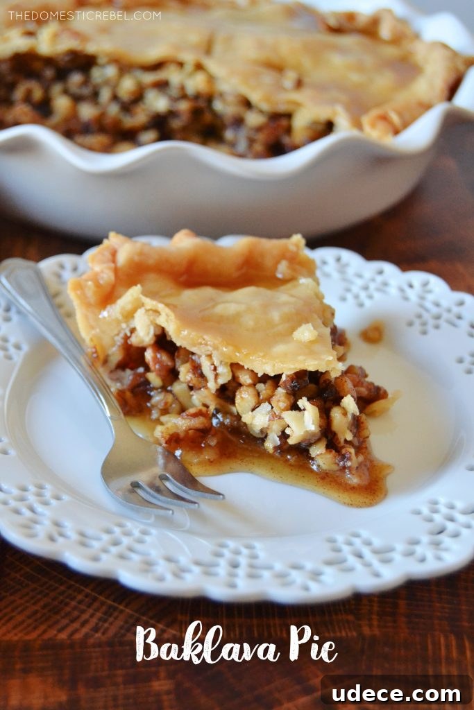 Crispy Baklava Pie Recipe with Honey-Walnut Filling 2 slice of baklava pie on a white lacy plate with a silver fork