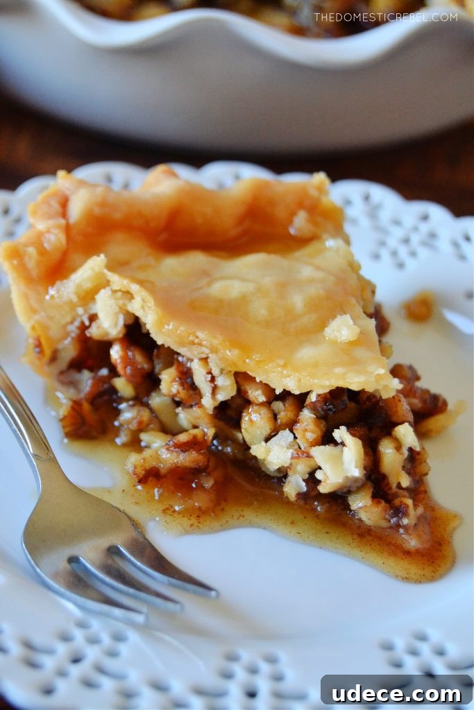 Crispy Baklava Pie Recipe with Honey-Walnut Filling 5 closeup slice of baklava pie on a white lace plate