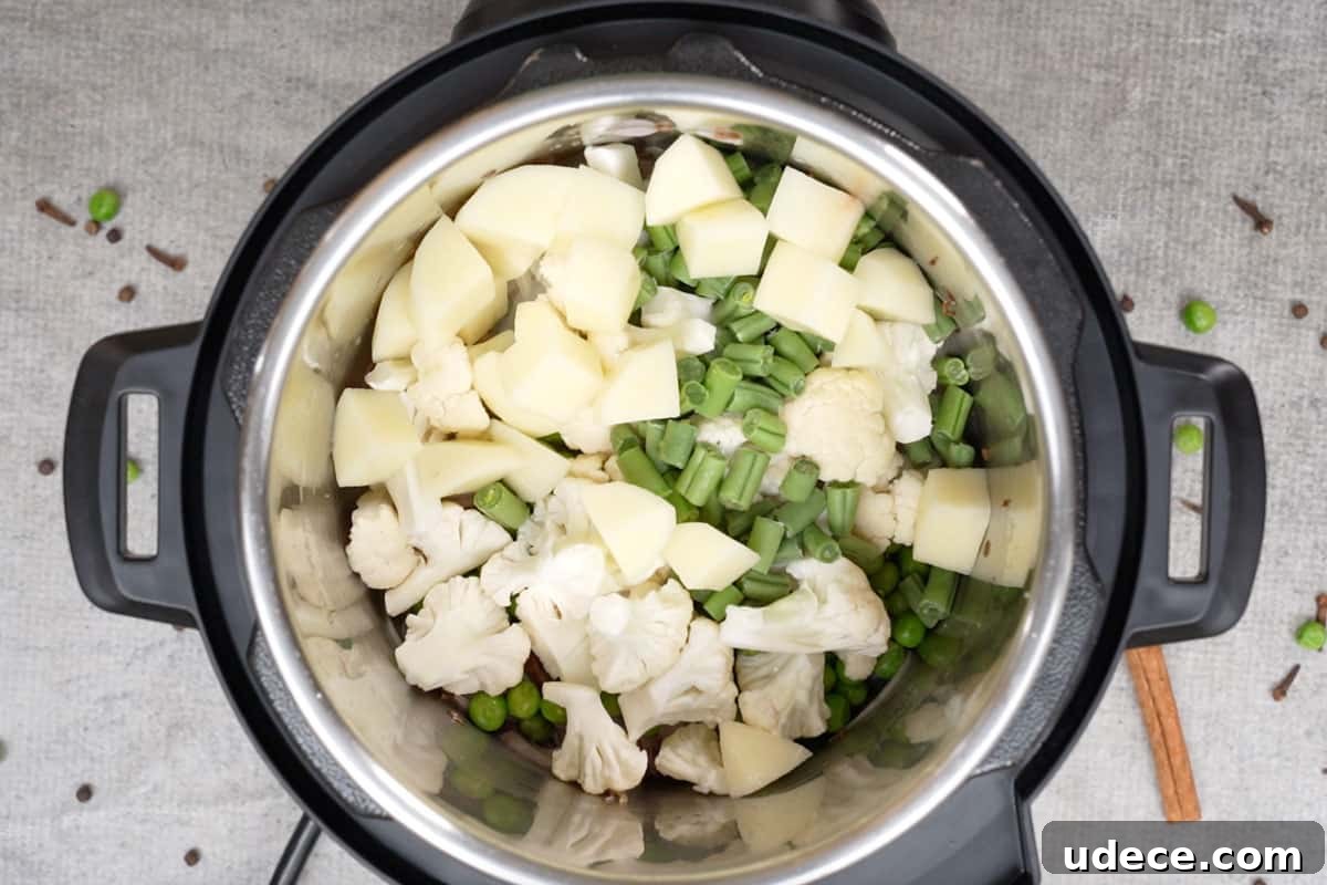 Flavorful Brown Rice Pulao: Aromatic One-Pot Indian Rice Recipe 7 Veggies added to the pot.
