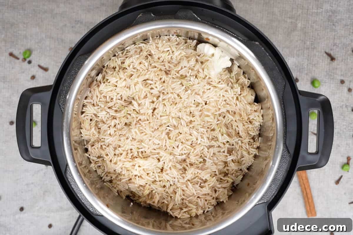 Flavorful Brown Rice Pulao: Aromatic One-Pot Indian Rice Recipe 8 Rice added to the pot.