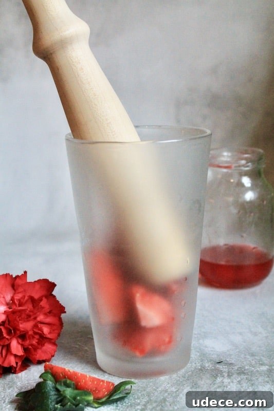 Sparkling Strawberry Satin Kiss: Valentine's Day Rum Cocktail 9 muddle fresh strawberries