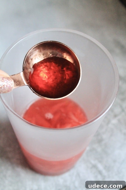 Sparkling Strawberry Satin Kiss: Valentine's Day Rum Cocktail 10 add cherry syrup, lemon, and rum
