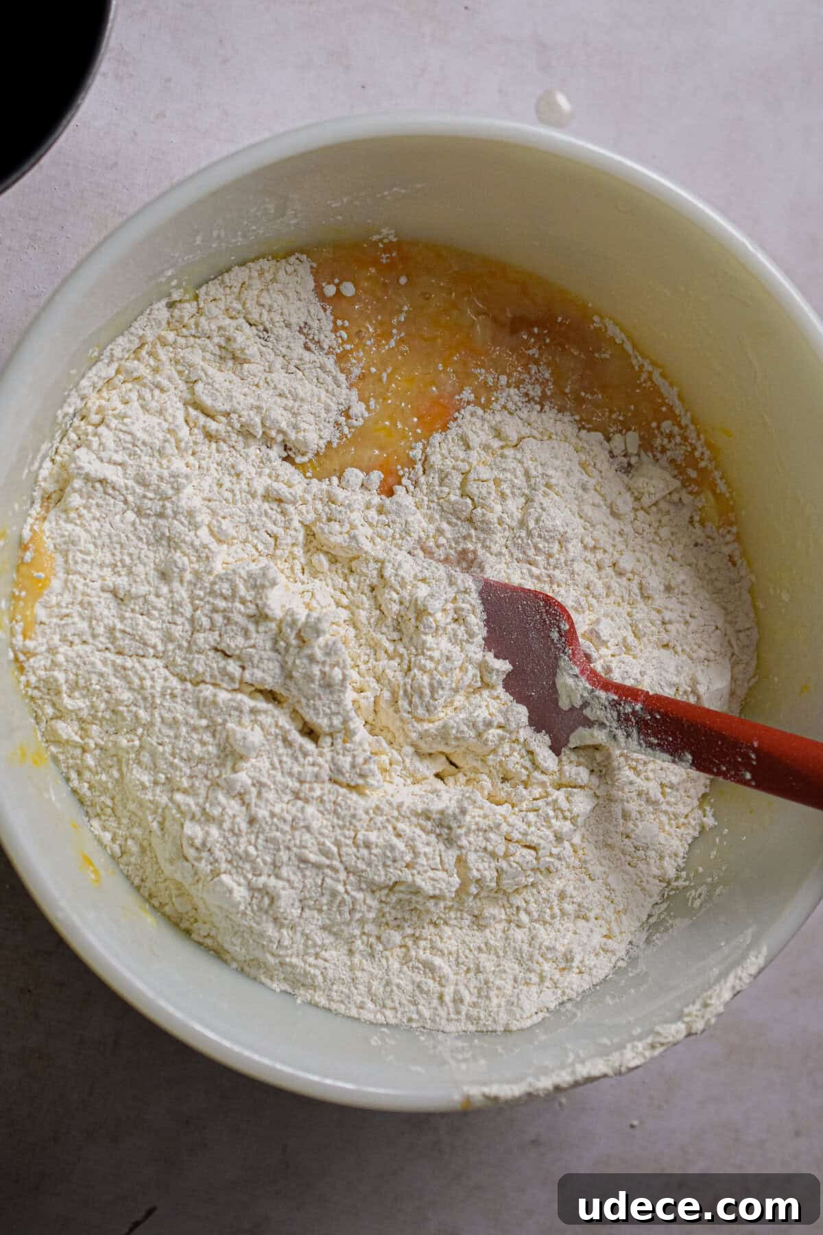 The self rising flour is added to the bowl.