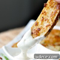 a roasted ranch potato being dipping into ranch dressing