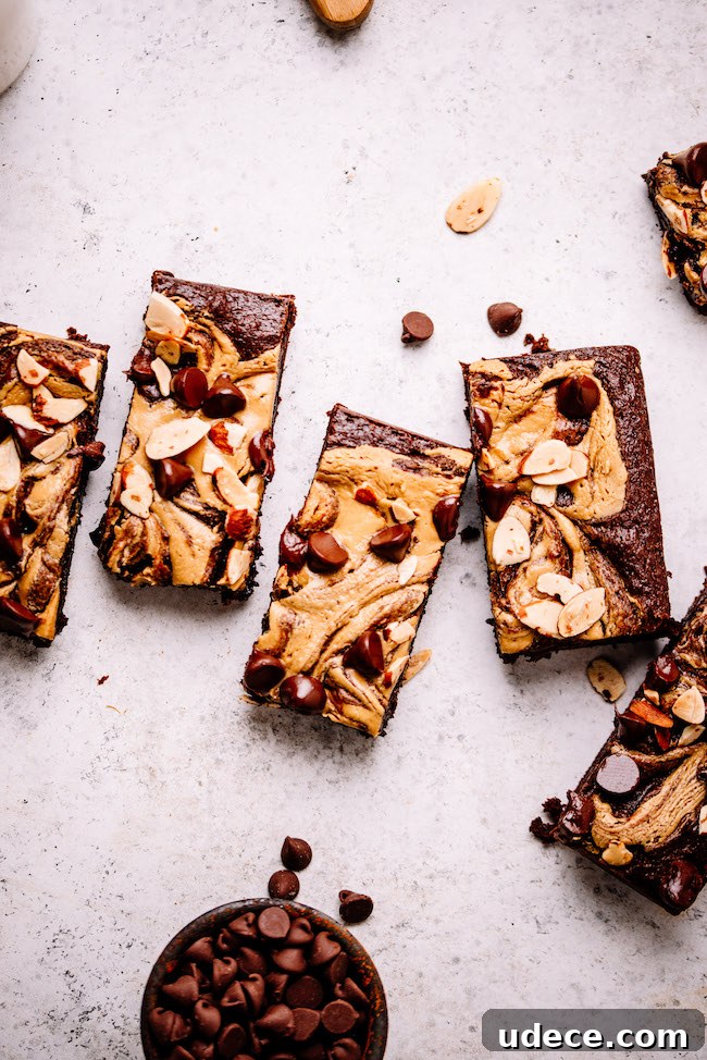Almond Butter and Tahini Brownies Recipe for Moist Fudgy Bars 6 almond butter swirled brownies on a backdrop
