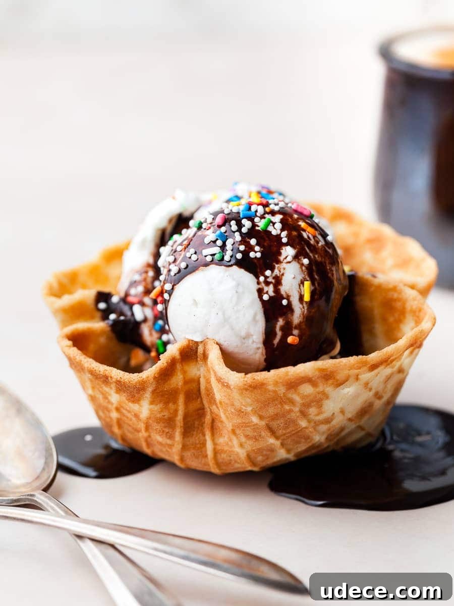 No-Churn Vanilla Ice Cream (Gluten-Free Recipe) 13 a gluten free waffle bowl with no churn vanilla ice cream, hot fudge sauce and sprinkles