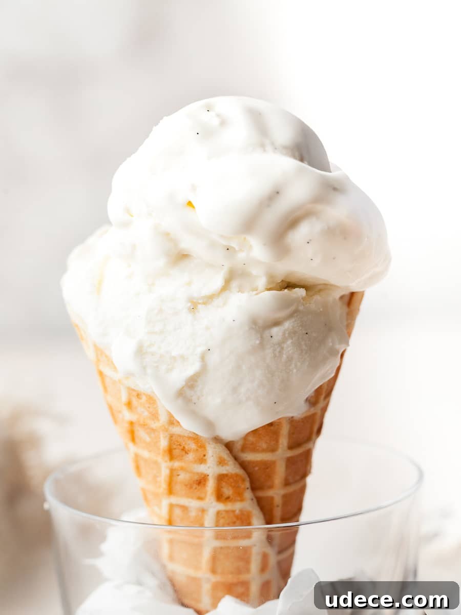 No-Churn Vanilla Ice Cream (Gluten-Free Recipe) 4 gluten free no churn vanilla ice cream on top of a gluten free waffle cone