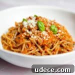 Roasted Red Pepper Pesto Pasta — Gluten-Free Recipe 13 Red pepper pesto pasta in a bowl.