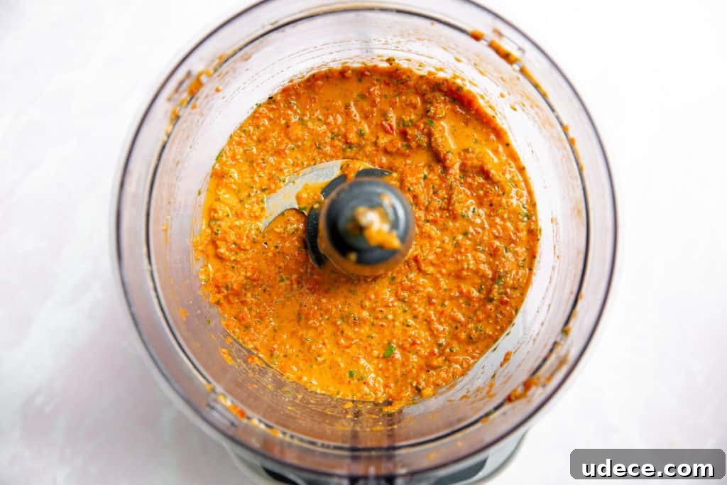 Roasted Red Pepper Pesto Pasta — Gluten-Free Recipe 9 Roasted red pepper in a food processor.