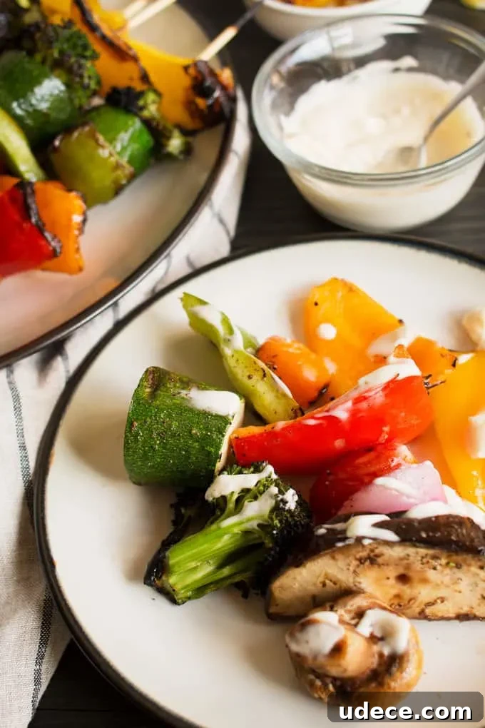 Colorful Grilled Vegetable Kabobs with Zesty Marinade 7 These rainbow veggie kabobs are the perfect summer side dish! Serve them with my delicious and easy to make grilled lemon garlic sauce.