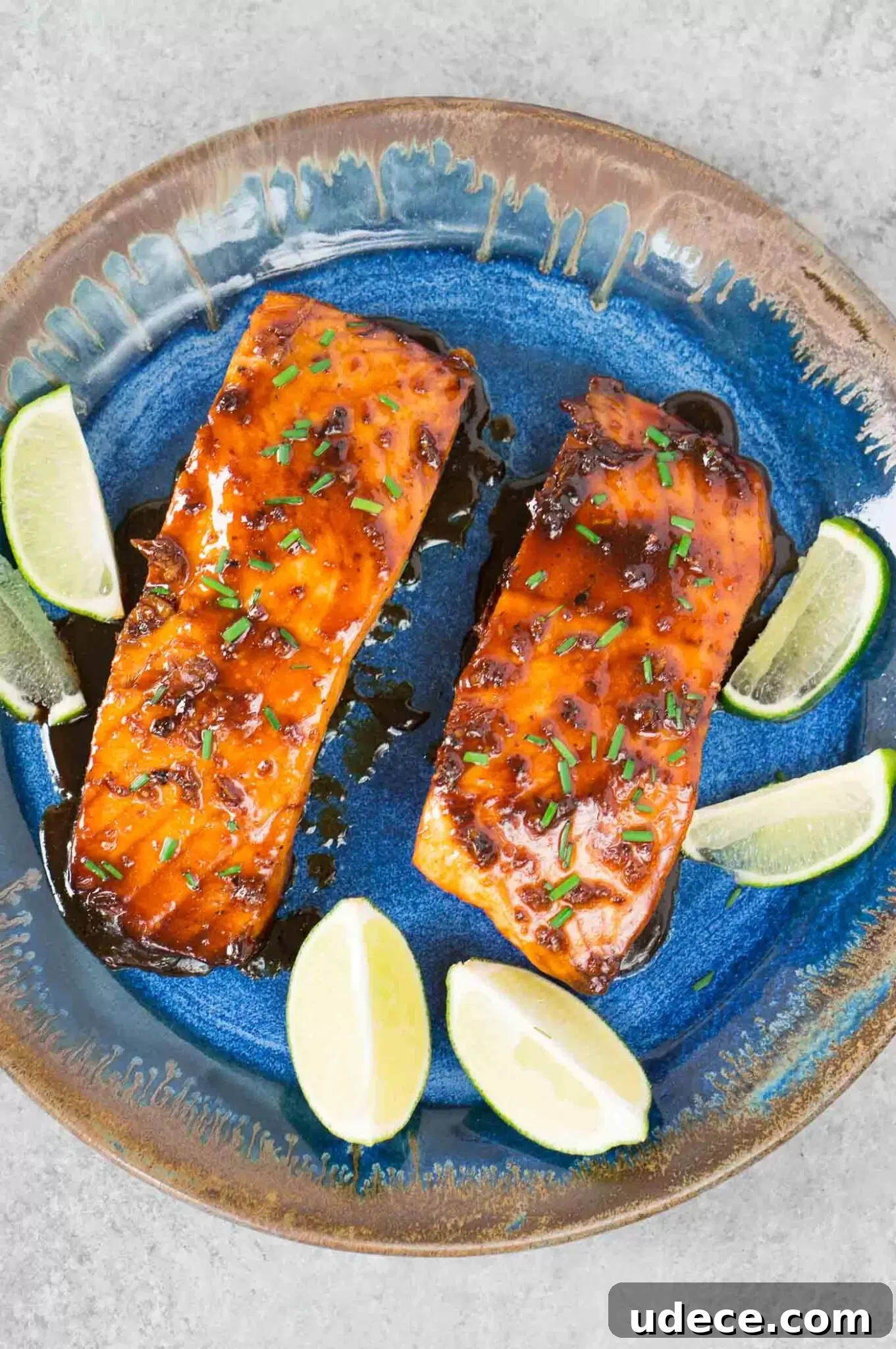 Sticky Honey-Glazed Salmon with Garlic and Soy 6 honey glazed salmon fillets on a plate