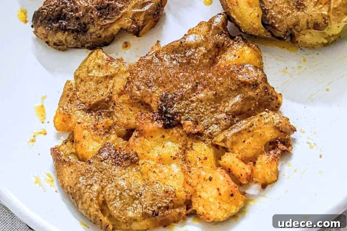Crispy Air Fryer Vegetable Sides That Steal the Show 12 Smashed potatoes on a white plate