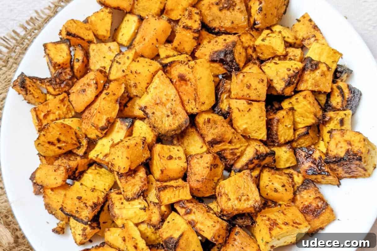 Crispy Air Fryer Vegetable Sides That Steal the Show 4 Roasted butternut squash cubes on a plate