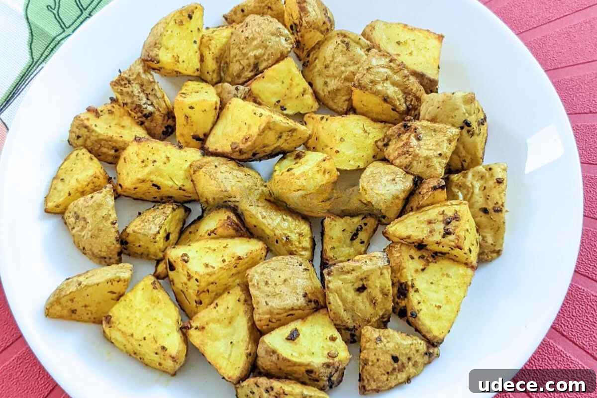 Crispy Air Fryer Vegetable Sides That Steal the Show 8 Roasted potato cubes on a plate