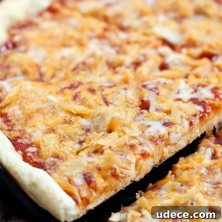 Week 33 Meal Plan for Group 1: Daily Dinner & Prep Guide 7 Slice of pizza topped with chicken, cheddar cheese, and barbecue sauce being lifted from the pie.