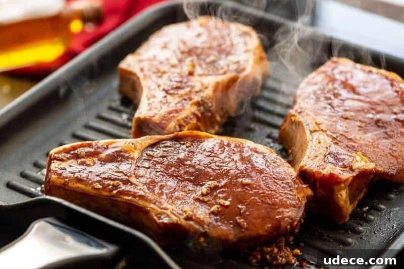Savory Pork Chop Marinade for Juicy Grilled Chops 5 Marinated pork chops on grill pan