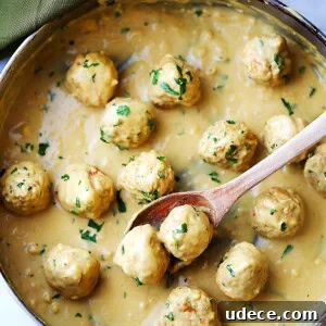 Savory Turkey Swedish Meatballs with Creamy Dill Sauce 2 Turkey Swedish meatballs with homemade gravy in the pan.