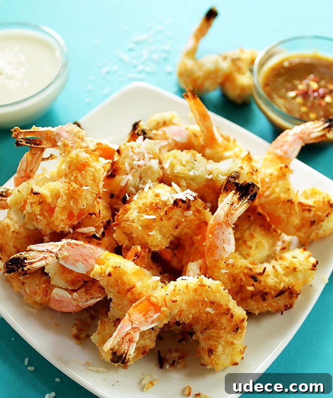 Crispy Baked Coconut Shrimp with Pineapple and Sweet Chili Dips 4 Baked Coconut Shrimp with 2 dipping sauces. Crispy, coconutty. Easy to make, no frying required! Perfect for a summertime meal! #glutenfree #shrimp