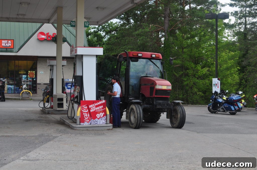 Amish man gassing up tractor