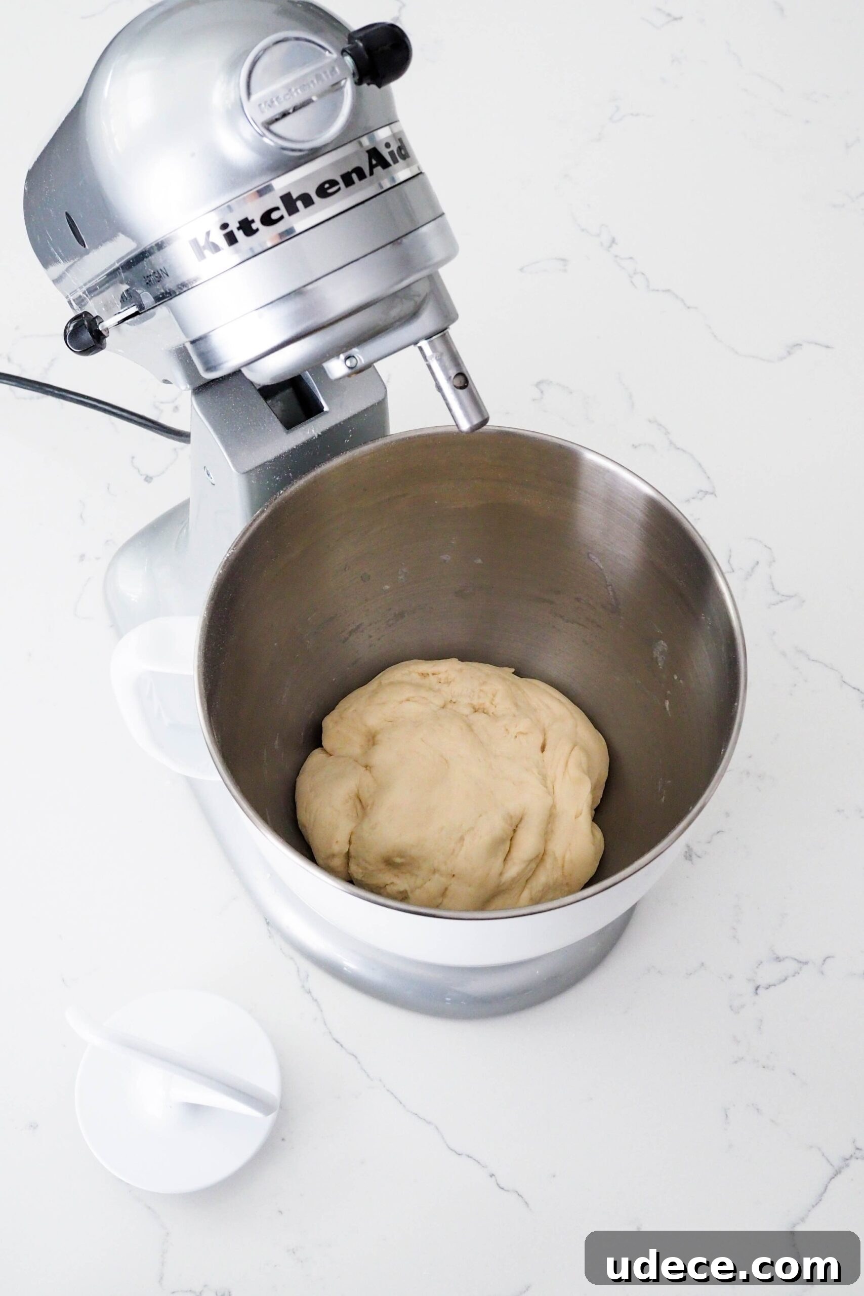 Crispy Homemade Garlic Breadsticks with Parmesan and Herbs 6 Freshly kneaded enriched dough in a mixer bowl.