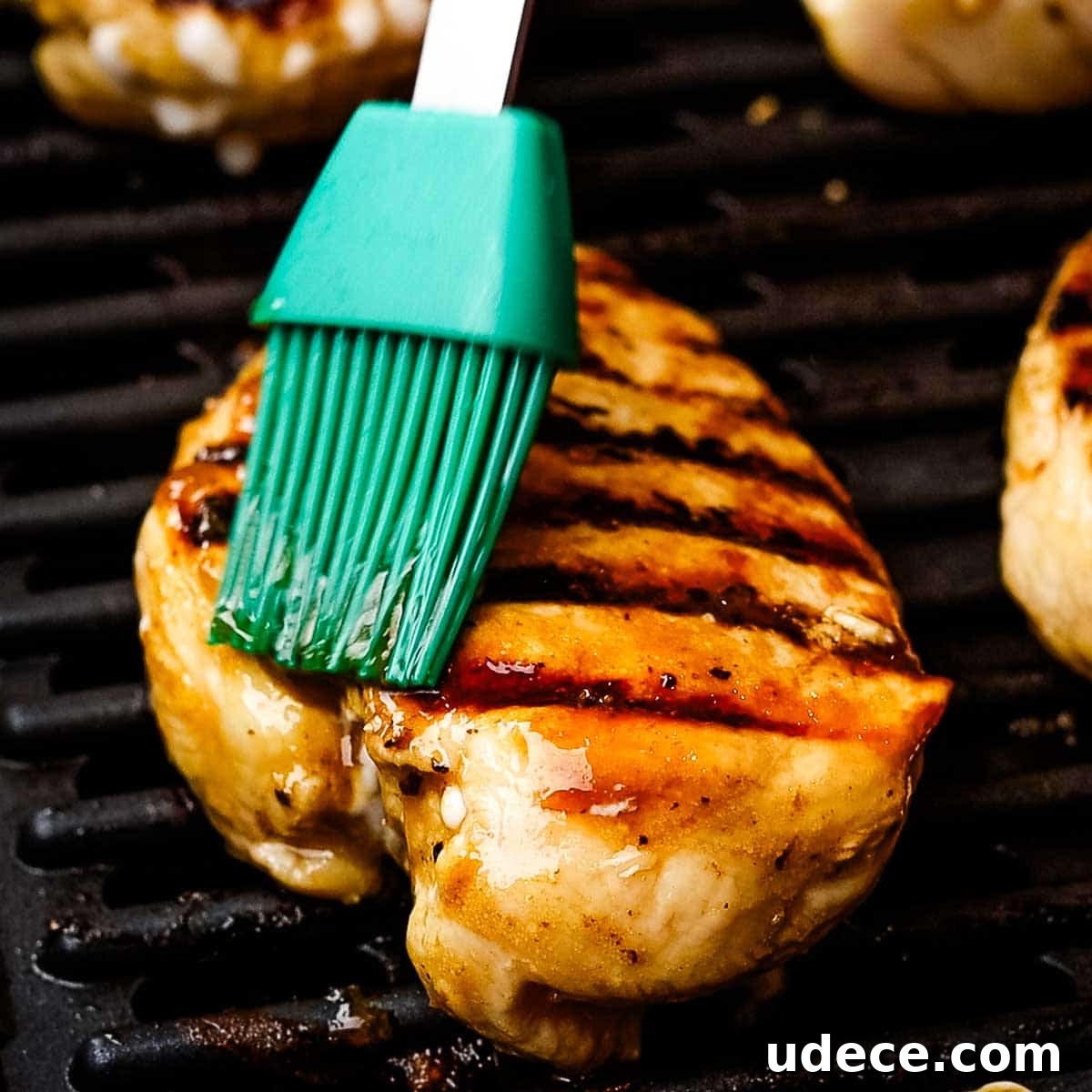 Grilled Balsamic Chicken with Garlic and Rosemary Marinade 8 basting chicken breasts with excess marinade