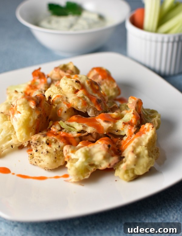 Buffalo Cauliflower with Vegan Blue Cheese Dip 2 Buffalo cauliflower with faux blue cheese dip is a migraine friendly vegetarian alternative to the traditional game day food. Fresh goat cheese provides a tangy, creamy flavor!