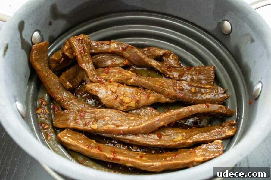 chili lime jerky strained in colander