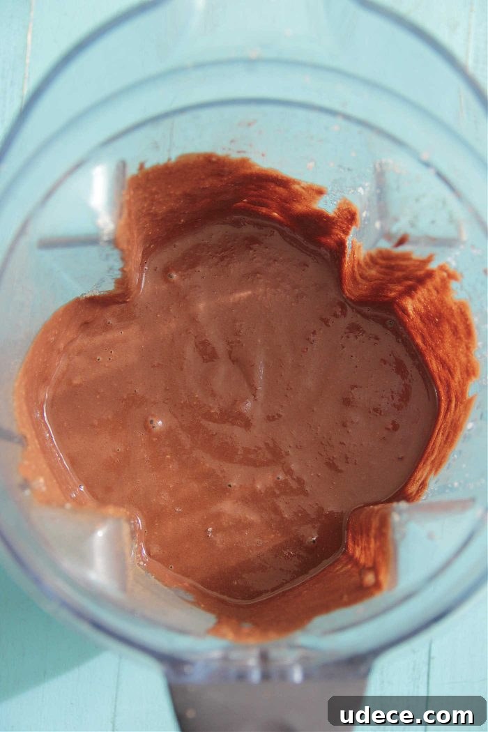 Chocolate Protein Blender Muffins — Quick No-Fuss Recipe 3 Chocolate Protein Blender Muffin batter in a blender