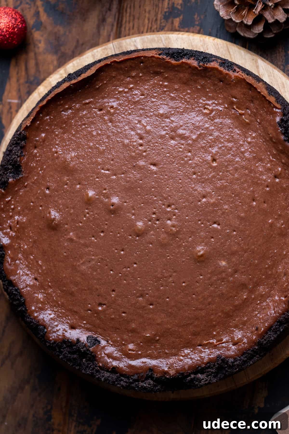 Baked cheesecake on a wood board.