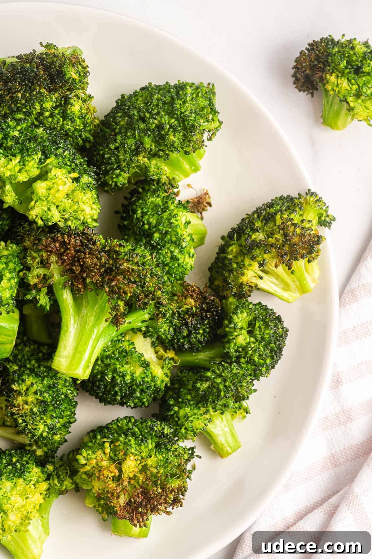 Crispy Air Fryer Broccoli Recipe — Quick Roasted Florets 6 air fried broccoli on a plate