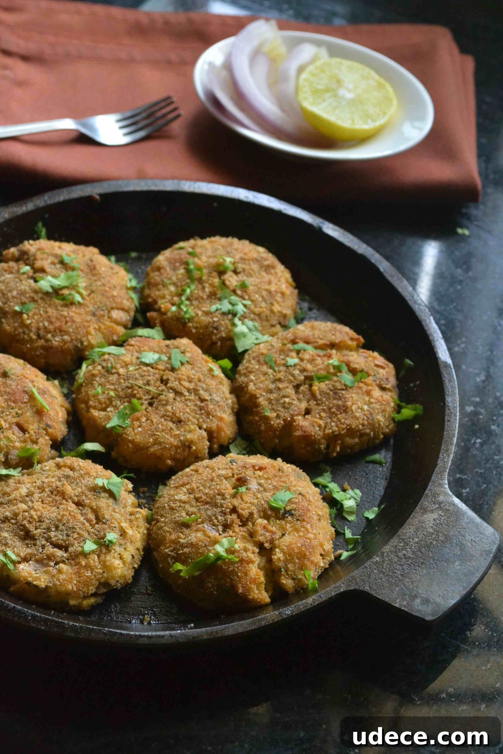 Served cutlets with onion and lemon