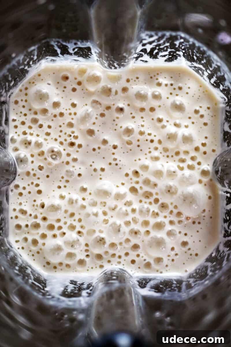 Vegan Coconut Cream Bars — Low-Carb, Gluten-Free Dessert 10 An overhead shot of the blended filling ingredients for coconut cream bars.