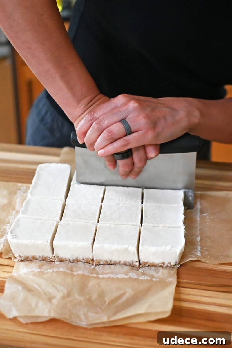 Vegan Coconut Cream Bars — Low-Carb, Gluten-Free Dessert 13 Cutting coconut cream bars with a pastry cutter.