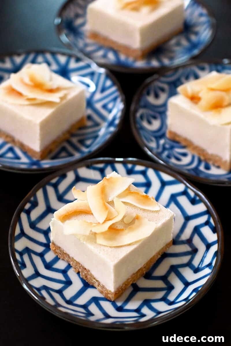 Vegan Coconut Cream Bars — Low-Carb, Gluten-Free Dessert 3 Plates of Coconut Cream Bars arranged on a black surface
