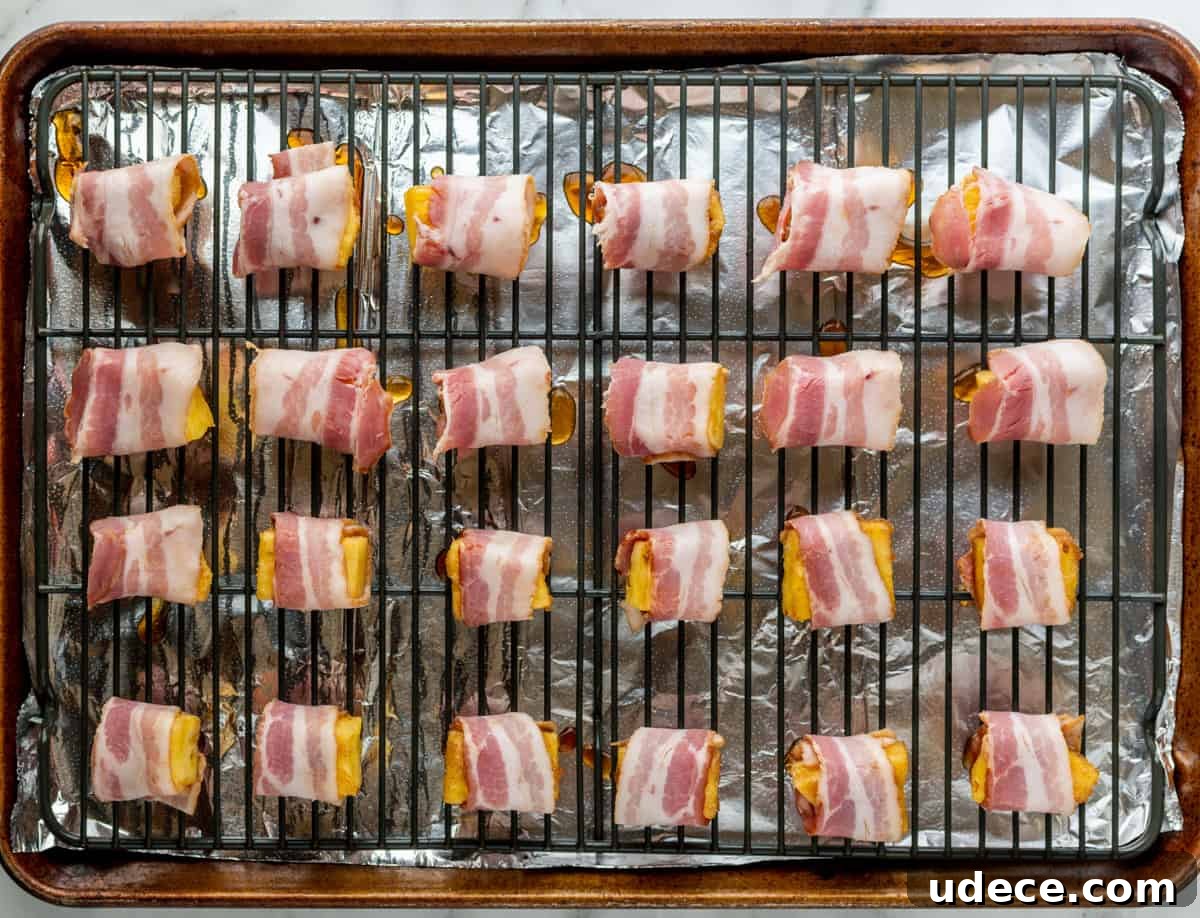 Crispy Bacon-Wrapped Pineapple Bites: Sweet and Savory Appetizer 8 Bacon Wrapped Pineapple before baking.