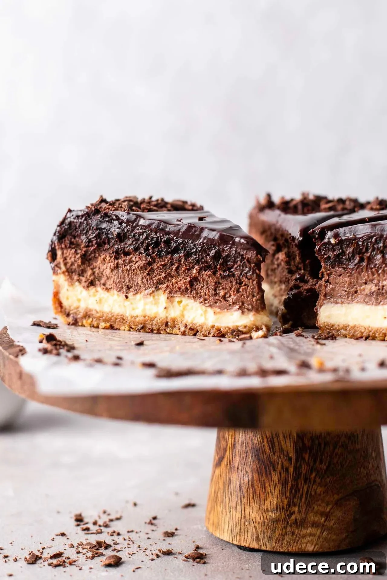 Decadent Chocolate Ombré Cheesecake Recipe 2 sliced ombre cheesecake on wooden cake stand (2)