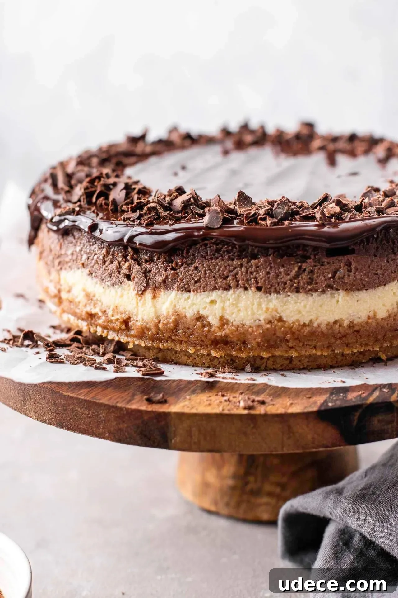 Decadent Chocolate Ombré Cheesecake Recipe 3 ombre cheesecake on wooden cake stand (3)