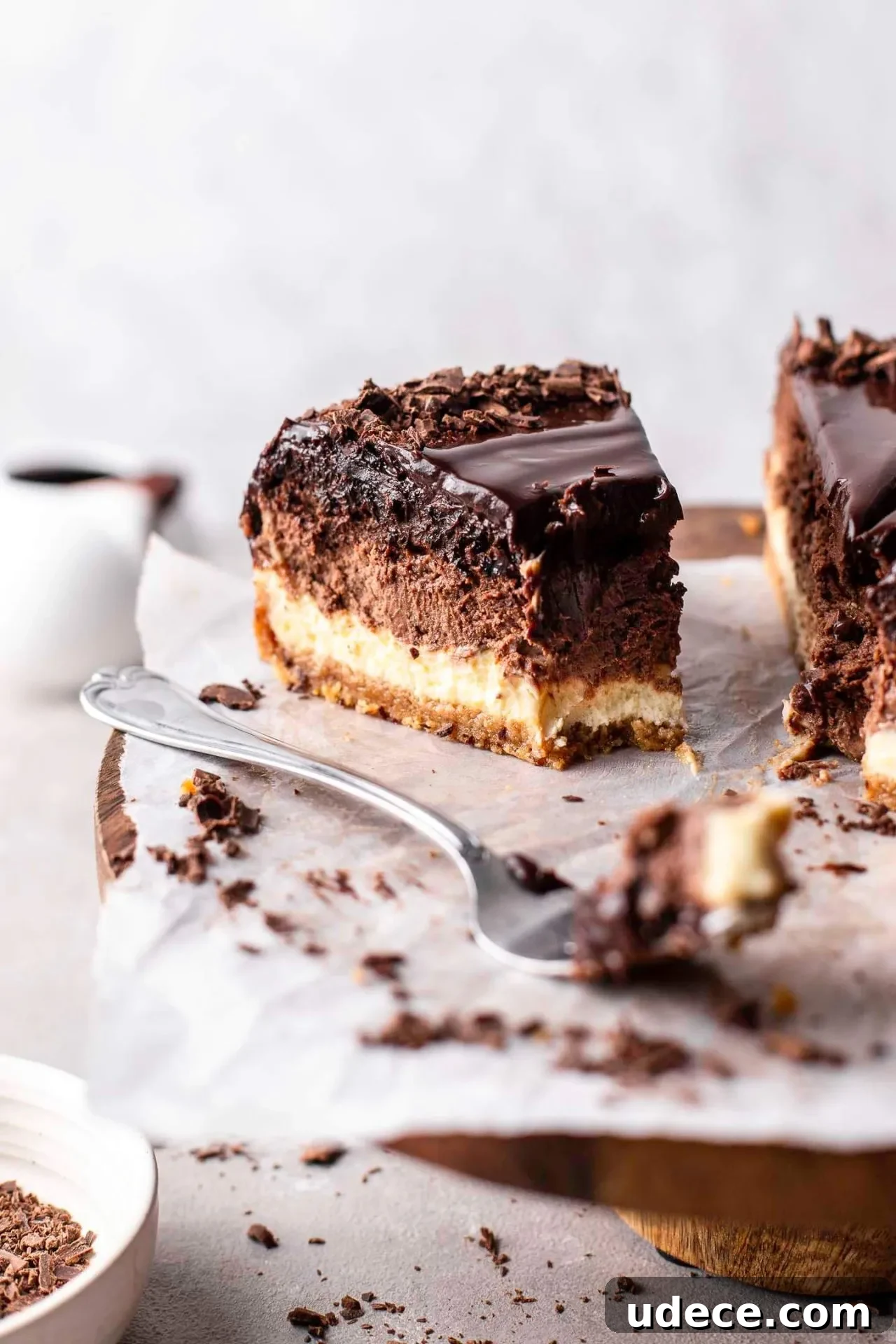 Decadent Chocolate Ombré Cheesecake Recipe 7 sliced ombre cheesecake on wooden cake stand (7)
