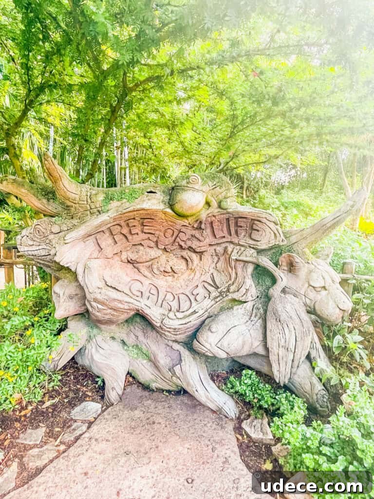 Discovering the Tree of Life at Disney's Animal Kingdom 4 Tree of Life Garden sign carved in wood.