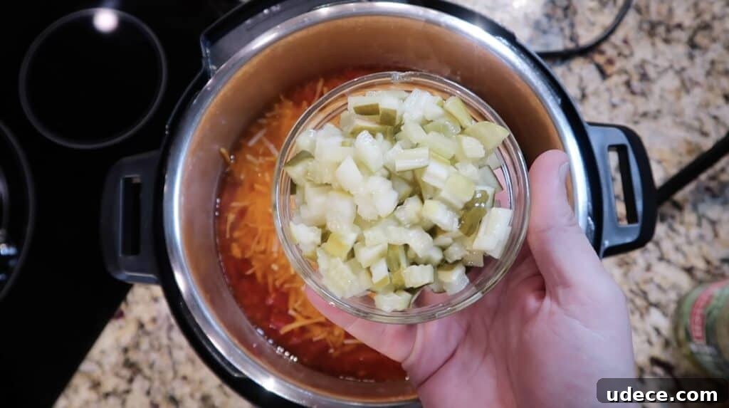 Instant Pot Deluxe Hamburger Stew Recipe in 30 Minutes 16 Adding diced pickles to pot