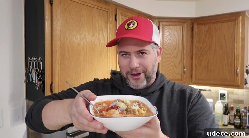 Instant Pot Deluxe Hamburger Stew Recipe in 30 Minutes 22 Man showing stew