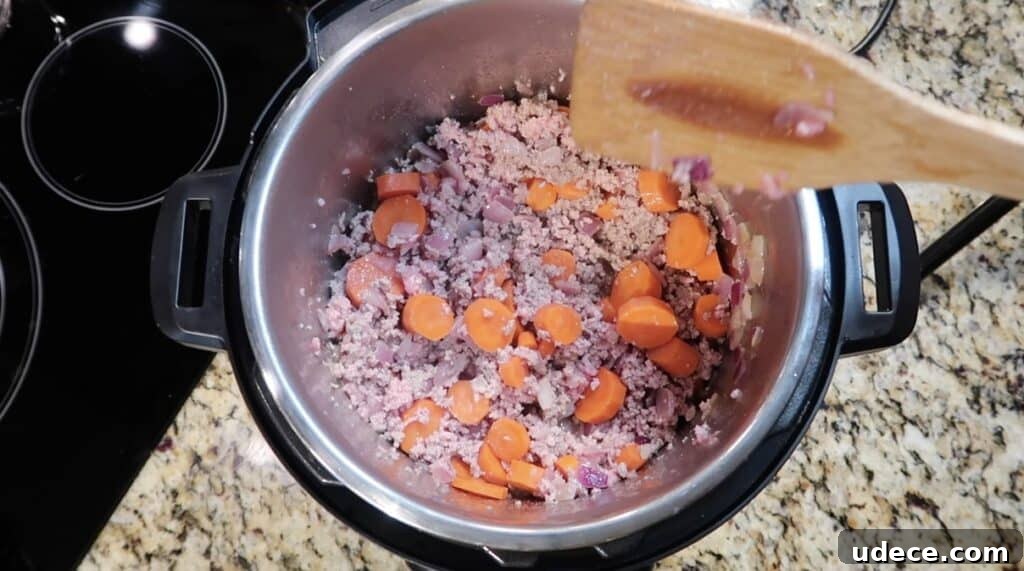 Instant Pot Deluxe Hamburger Stew Recipe in 30 Minutes 7 Sautéing meat with veggies