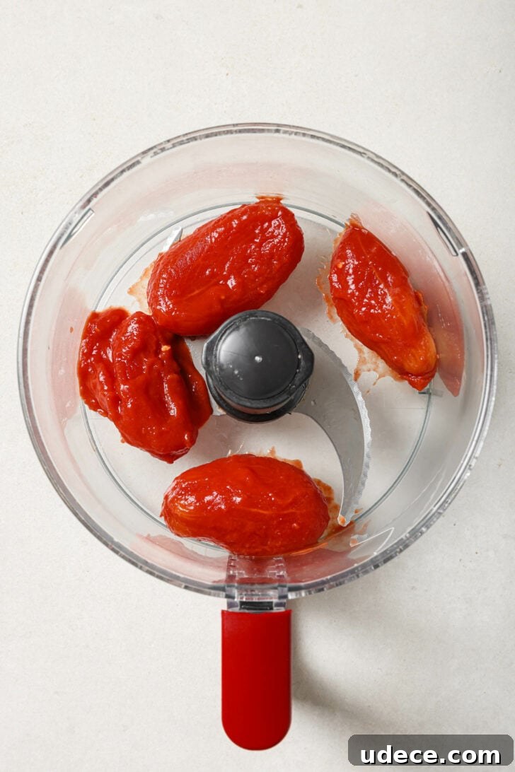 Authentic Butter Chicken Recipe: Tried and Perfected After 20 Tests 14 Drained whole tomatoes in a food processor ready to be puréed.